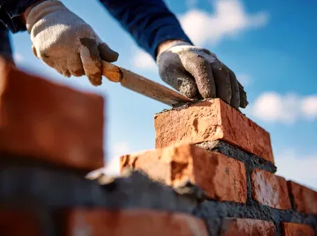 Rebuilding a chimney top with new brick in Upland